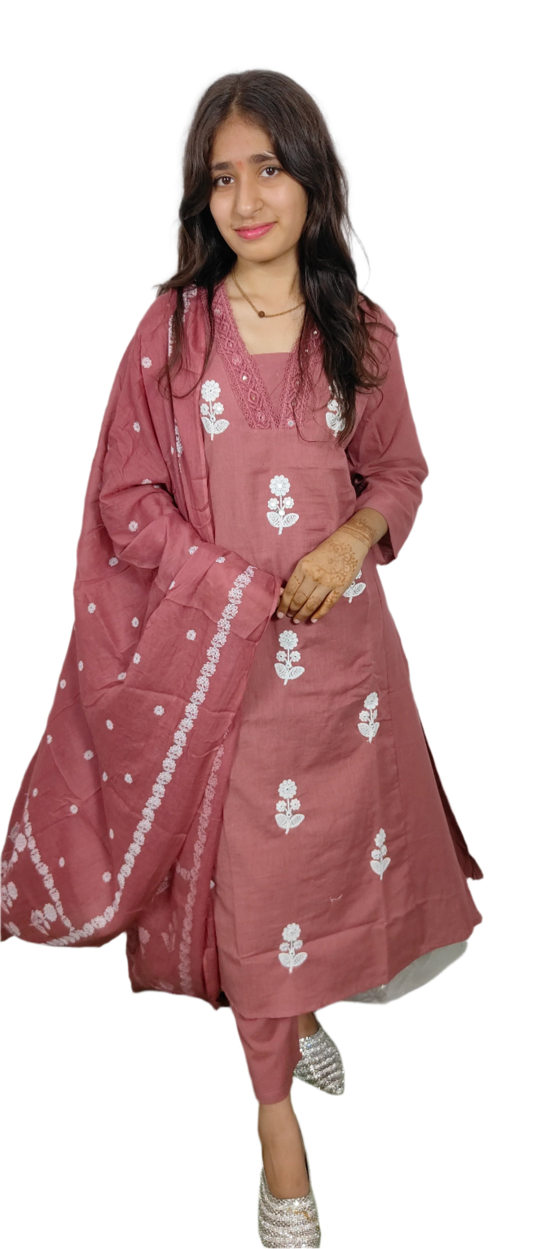 Woman wearing a traditional outfit with a pink dupatta and white embroidery on a white background