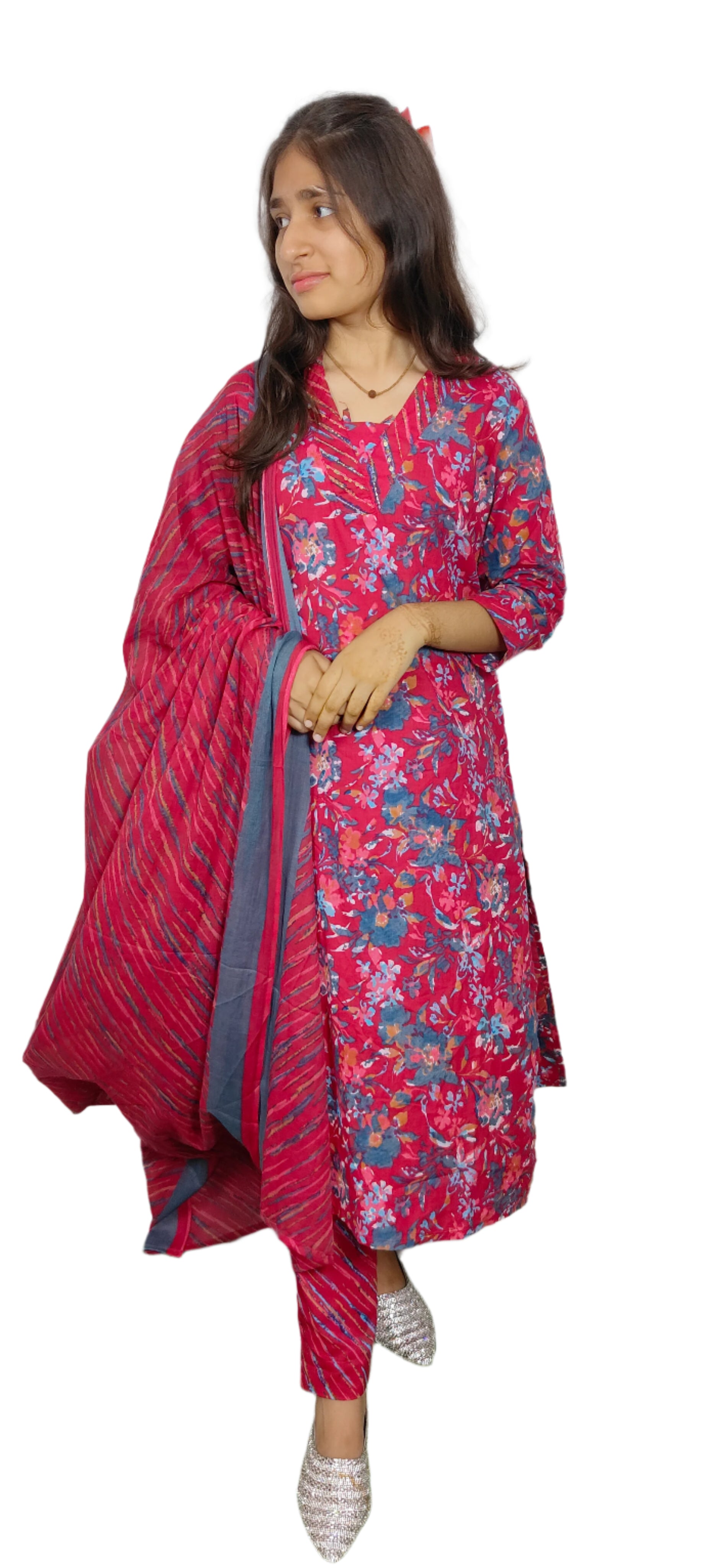 Woman wearing a red floral outfit with a white background